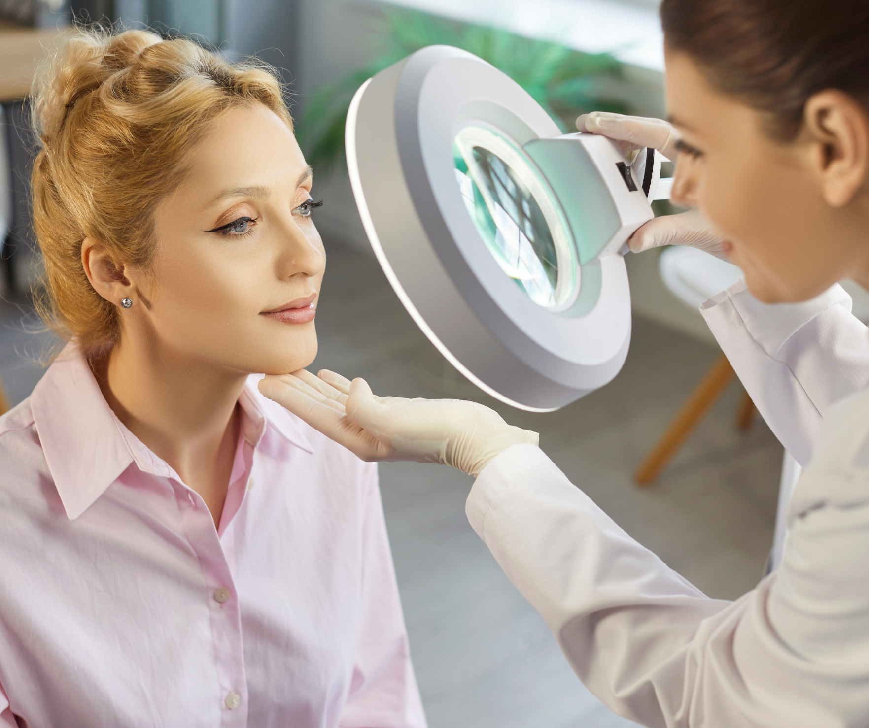Practitioner examining patient's skin
